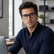 Model wearing Metro Blue Light Frames in a natural lifestyle setting