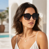 Model wearing Solstice Oversized Sunglasses in a natural lifestyle setting
