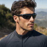 Model wearing Aero Wrap Sports Glasses in a natural lifestyle setting
