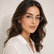 Model wearing Celeste Oval Optical Frames in a natural lifestyle setting