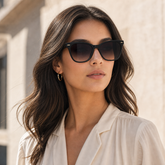Model wearing Maris Butterfly Sunglasses in a natural lifestyle setting
