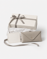 Eyra eyewear gift wrap packaging with ribbon, tissue paper, card, and case